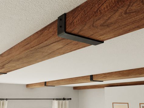 Wood Beam Lighting, Beam Brackets Metal, Wood Beam Low Ceiling, Styrofoam Wood Beams, Decorative Ceiling Beams, Basement Beam Cover Ideas, Beam Separating Kitchen And Living Room, Faux Beams In Kitchen, Steel Beams Interior