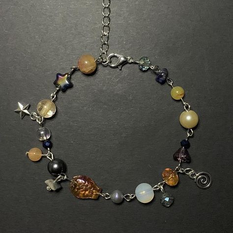 *ੈ✩‧₊• orange / dark blue / purple clutter bracelet w dangly charm + bead detail Bead Bracelet With Charm, Dark Beaded Bracelets, Bead And Charm Bracelet, Charm Bracelet Inspiration, Dangly Bracelets, Cute Homemade Bracelets, Jewellery Homemade, Clutter Jewelry, Dark Bracelet