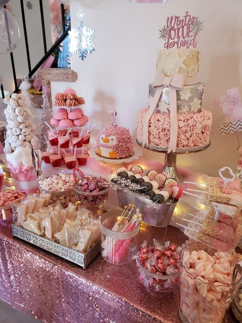 Winter ONEderland dessert table Winter Onederland Sweet Table, Winter Onederland Candy Table, Winter Onederland Party Table Decor, Winter Onederland Snacks Food Ideas, Candy Onederland 1st Birthdays, Winter Onederland Cake Table, Winter Onederland Treat Table, Snowflake Dessert Table, Pink Winter Wonderland Dessert Table