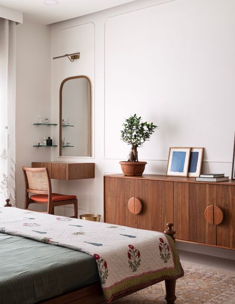 Brushstrokes of warmth and earthy hues emerge in a Chennai home designed by 85isto15 - ELLE DECOR Guest Bedroom Tv Unit, Indian Hotel Room, Guest Bedroom Wardrobe, Bedroom With Wardrobe, Earthy House, Indian Hotel, Dressing Unit, Indian Bedroom, Bedroom Design Inspiration