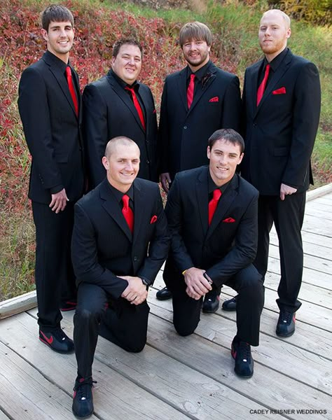 Classy matching tuxs with bright red ties - paired with comfy Nike sneakers Suit For Summer Wedding, Black And Red Tuxedo, Black And Red Tux, Black Suit Red Tie, Wedding Suit For Groom, Red Tux, Black Groomsmen Suits, All Black Tuxedo, Black Groomsmen