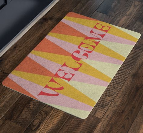 Add some character to your home and entryway with a stylish doormat. The vibrant top will impress your guests while keeping your home clean from outside dirt and debris. The foam rubber backing will protect your floor and reduce slipping.• Size: 26”x18”• Felt-Like Polyester Top• Foam Rubber Backing Apartment Door Mat, Puppy List, Groovy Retro, Tiny Apartment, Outdoor Mat, Apartment Inspiration, Welcome Mat, Outdoor Door Mat, Polyester Top