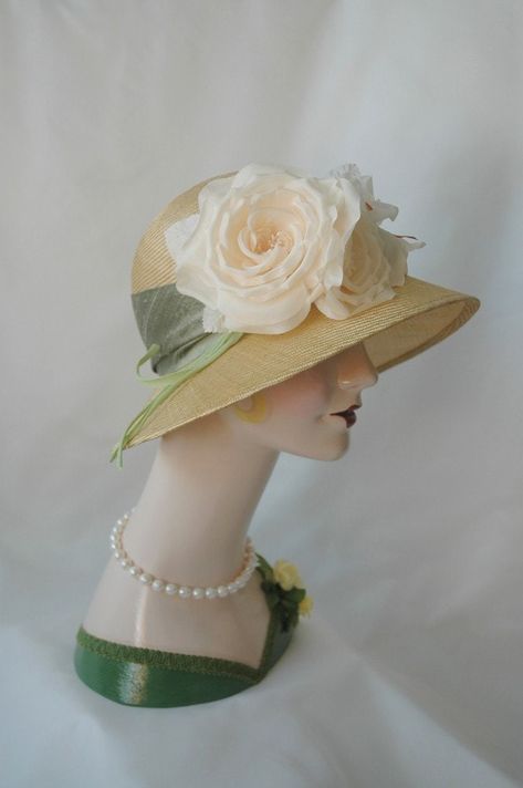 "A wide brimmed, antique honey colored, vintage inspired flapper hat - a lovely hat for a wedding, garden party, or ladies tea luncheon.  In the 1920s, this style was popular for a daytime look and was often trimmed with flowers. This design was handmade and hand-blocked on a vintage hat block, dating from the 1920s, using honey colored parasisal straw.  A wide sash of sage silk dupioni encircles the crown.  Two luscious ivory silk roses, with buds, leaves, and stems, accent the hat.  The brim w 1920s Straw Hat, 1920s Hats, Wedding Garden Party, Garden Hat, Ladies Tea, Ladies Hats, Gardening Hat, Flapper Hat, Pretty Hats