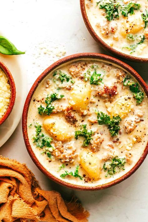 This easy Zuppa Toscana recipe, inspired by the Olive Garden version, uses store-bought gnocchi as a shortcut to bring this delicious creamy sausage and kale soup together in less than 30 minutes. A gluten-free dinner recipe that's easy to also make vegetarian (with plant-based sausage) if you prefer! | gimmesomeoven.com Sausage Kale Pasta, Olive Garden Gnocchi Soup, Sausage And Kale, Sausage And Kale Soup, Zuppa Toscana Soup, Gnocchi Soup, Homemade Soup Recipe, Gimme Some Oven, Kale Soup