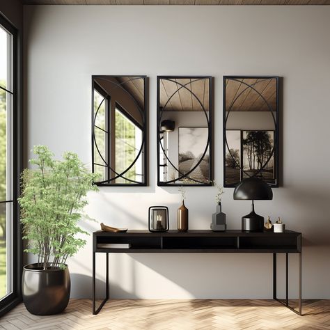 Upgrade your living space with these premium quality black metal rectangular wall mirrors. The set includes three mirrors with a contemporary design that can be arranged together or separately in various locations to add a personalized touch to your decor. The mirrors boast a high-quality glass surface that provides crystal-clear reflections, making them perfect for both functional and decorative purposes. The beautiful modern design features two semicircles intersecting in the middle, allowing Dining Wall Mirror Design, Kitchen Wall Mirror Decor Ideas, Mirror Accent Wall Ideas, Wall Mirrors Decor Ideas Living Room, Mirror In Dining Room Ideas, Mirror Wall Entryway, Decorative Mirrors Wall Living Room, Dining Room Mirror Ideas Wall Decor, 3 Mirrors On Wall Ideas