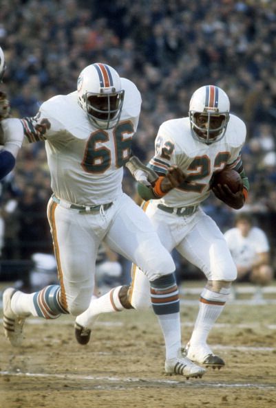 Larry Little of the Miami Dolphins leads running back Mercury Morris 1972 Miami Dolphins, Nfl Uniforms, Ole Miss Football, Nfl Football Pictures, American Football League, Miami Dolphins Football, Nfl Football Players, Dolphins Football, Nfl Miami Dolphins