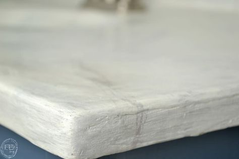 Easy DIY concrete countertops can be installed right over your old countertop surface using a feather finish flooring concrete. Feather Finish Concrete Countertops, Drop Cloth Slipcover, Diy White Concrete Countertops, Paint Tiles, Diy Concrete Counter, Natural Stone Counter, White Concrete Countertops, White Granite Countertops, Cheap Countertops