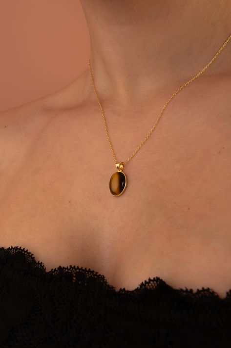 Elegant 14k gold necklace with a luminous Tigers Eye pendant, hanging gracefully on a sterling silver chain. Tiger Eye Pendant, Tigers Eye Jewelry, Tiger Eye Necklace, Tiger Necklace, Necklace Outfit, Gold Tiger Eye, Tiger Eye Jewelry, Bohemian Vibes, Tigers Eye Necklace