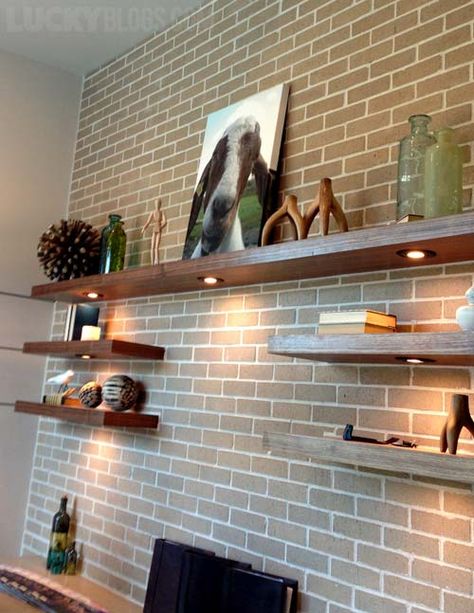 Floating Shelf On Brick Wall, Large Floating Shelves Office, Wood Shelf Brick Wall, Brick Wall With Floating Shelves, Floating Shelves Office Wall Shelves, Large Wall Floating Shelves, Lights Under Floating Shelves, Staggered Floating Shelves Office, Brick Wall Shelves