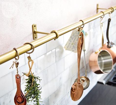 DIY pot rail—Searching for a stylish pot rail? Look no further than the curtain aisle: Drapery rods make apt stand-ins. Use clip rings for lighter items and S-hooks for heavier pieces. Parisian Style Kitchen, Kitchen Organisation Hacks, Pot Rail, Small Kitchen Storage Solutions, Kitchen Rails, Small Kitchen Storage, Diy Pots, Kitchen Storage Solutions, Curtain Hardware