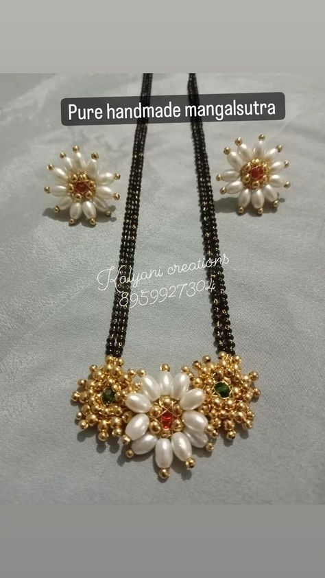 Pure handmade mangalsutra Colour can be customise For order 8959927304 Whatsapp https://chat.whatsapp.com/IaR62SJCZ2k0YVpJbIkIVl Instagram https://www.instagram.com/invites/contact/?i=gmqlcekup3t1&utm_content=m205bo4 YouTube https://youtube.com/channel/UCrWdElOTpHRmMq88Z2CKccg #reels #reelsinstagram ,#reelsvideo , #reelitfelit , #explore , #explormore , #explorepage , #jewelry ,#jewellery ,#bulk ,#usa,#cenada ,#india,#tranding , #trandingreels♥️ , #instagood ,#instagram #fabricmirrormangalsu Maharashtrian Nath Making, Handmade Mangalsutra Designs, Handmade Mangalsutra, Moti Jewellery, Bridal Nath, Handmade Necklace Designs, Bridal Things, Rose Gold Jewelry Set, Wedding Jewelry Simple