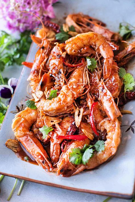 This Tiger shrimp (Prawns) with Thai tamarind sauce is a delightful combination of tangy, sweet, and savory flavors. Large tiger prawns are used for their meatiness. Cooked to perfection in the sweet and spicy tamarind sauce, creating a perfect balance of memorable flavors that will keep you coming back for more!  #tamarindshrimp #thaitamarindshrimp #shrimpintamarindsauce #thaishrimp #tamarindshrimprecipe #shrimpintamarindpaste #thaitamarindshrimprecipes Tamarind Shrimp Recipes, Tamarind Shrimp, Tamarind Fish, Thai Recipes Authentic, Tiger Prawns, Tiger Shrimp, Thai Shrimp, Pad Thai Sauce, Tamarind Sauce