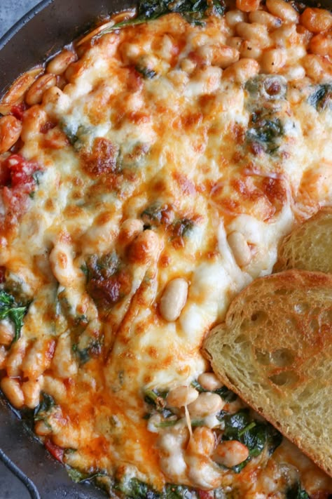 Cheesy White Bean Tomato Bake • Hip Foodie Mom Vegetarian Olive Recipes, White Beans Tomatoes, Cheesy Italian Baked Cannelini Beans, Pizza Beans Smitten Kitchen, Baked White Beans, Baking With Beans, Easy Casserole Recipes Vegetarian, Vegetarian Bean Casserole, Main Dishes With Beans