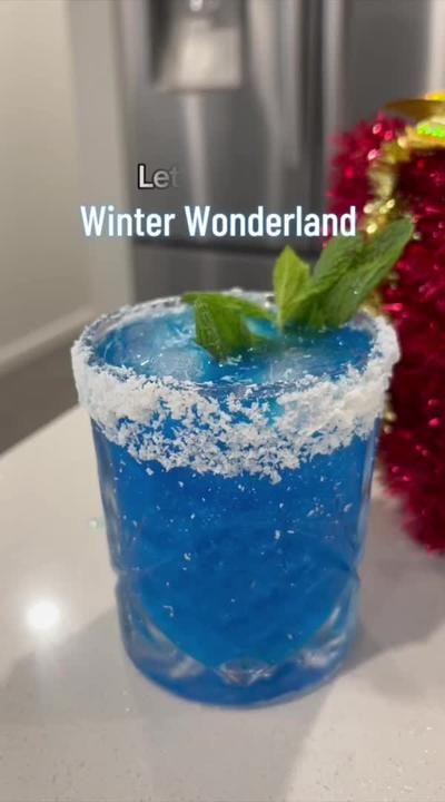 Blue Christmas Cocktail Recipe, Mint Christmas Cocktail, Blue Tequila Cocktails, Blue Christmas Drinks Holiday Cocktails, Blue Christmas Cocktails, Winter Wonderland Drinks, Tequila Christmas Cocktails, Blue Winter Wonderland Christmas, Winter Wonderland Cocktail