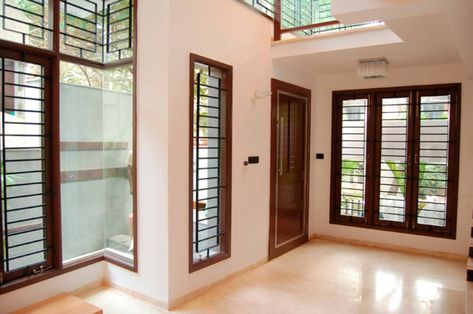 House of dr. hariharan modern living room by murali architects modern | homify Indian Window Design Living Rooms, French Windows Living Room Indian, Murali Architects, Indian Window Design, Front Window Design, Modern Corridor, Wooden Window Design, Modern Window Design, Modern Window Grill