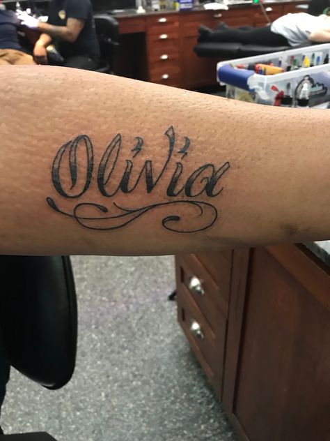 OLIVIA cursive name tattoo Olivia In Cursive, Olivia Tattoo Name, Olivia Name Tattoo, Olivia Tattoo, Olivia Name, Rose Tattoo With Name, Olive Tattoo, Tattoo Name Fonts, Wooden Letters For Nursery