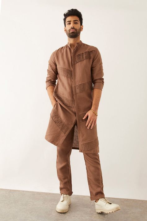 Brown linen kurta with pintuck pleats, band collar and front buttoned placket. Components: 1 Pattern: Solid Neckline: Band Collar Sleeve Type: Three quarter Fabric: 100% Linen Color: Brown Other Details:  Side slits Closure : Front buttons Note : Pant worn by the model is not for sale. Occasion: Mehendi and Puja - Aza Fashions New Pattern Kurta For Men, Men’s Kurta Pattern, Kurta Styles Men, Kurta Pattern For Men, Kurta Collar Designs For Men, Mens Kurta Pattern, Men’s Kurta, Brown Kurta For Men, Linen Kurta Men