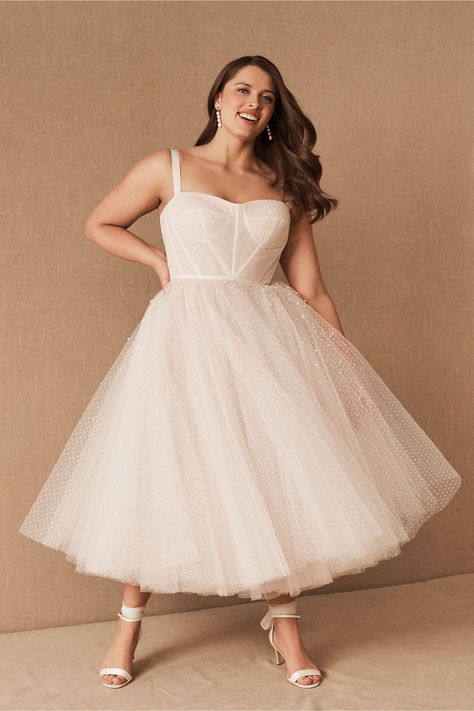 This vintage wedding dress with a tulle skirt is one of our WeddingWire editors' top picks. WeddingWire has tons of recommendations for wedding dresses and jumpsuits for all wedding types. Click for more courthouse wedding dress ideas. Planning your wedding has never been so easy (or fun!)! WeddingWire has tons of wedding ideas, advice, wedding themes, inspiration, wedding photos and more. {BHLDN} Maggie Soterro Wedding Dress Plus Size, Civil Wedding Outfit The Bride Plus Size, Floral Wedding Dress Simple, Short White Dress Plus Size, Plus Size Tea Length Wedding Dress, Nutcracker Wedding, City Hall Wedding Dress, Pop Wedding, Plus Size Midi Dress