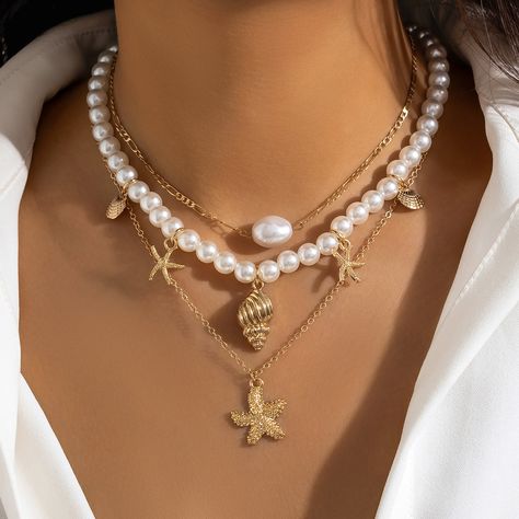 ✿Enchanting Ocean Vibes - 3-Piece Starfish Shell Pearl Necklace Set✿ ✿Share the magic of the ocean with someone special by gifting this enchanting set. Wear the set for elegant events, weddings, or anniversary celebrations.Ideal for individuals with a love for coastal aesthetics and those who appreciate the timeless elegance of pearls. Perfect for anyone seeking to add a touch of nature-inspired beauty to their daily attire.✿ Product information: Material: Alloy Color: Starfish Shell, Coconut Shell, Sun Cross Pendant Material: Alloy Shipping business days for this product: ✦ 7-12 days ✦ HI ! HOW ARE YOU ? ARE YOU ENJOYING ON MY LISTINGS? Check more of my listings here: https://designsbythaliaph.etsy.com MY SOCIAL MEDIA ACCOUNTS: Tiktoks: designsbythaliaph1st designsbythaliaph2nd designsbyt Pearl Necklace Set, Starfish Pendant, Star Pendant Necklace, Mermaid Necklace, Collar Jewelry, Shell Pendant, Shell Necklaces, Beaded Choker, Star Pendant