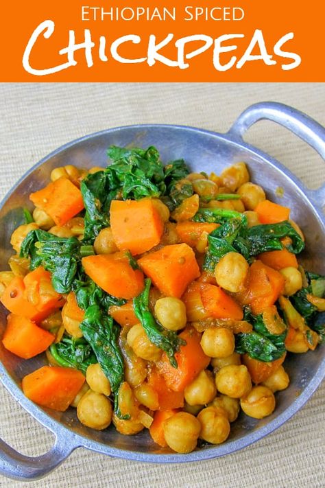 Spiced Ethiopian Chickpeas Side Dish - an easy vegetarian Ethiopian recipe to serve over injera or with some rice. Adjust the spice level to your liking! This recipe contains berbere, a traditional Ethiopian spice, as well as some cumin, turmeric, paprika, and coriander. Naturally gluten free and vegan. #ethiopianrecipes #ethiopianfood #chickpeasrecipes #spicyfood #sidedish #vegansidedish #vegetariansidedish #glutenfree #glutenfreesidedish #glutenfreerecipes #carrots #spinach #ethiopian Ethiopian Chickpeas, Vegan Ethiopian Recipes, Ethiopian Recipes, Chickpeas Recipe, Spiced Chickpeas, Gluten Free Sides Dishes, Ethiopian Food, Vegetarian Side Dishes, Vegan Side Dishes