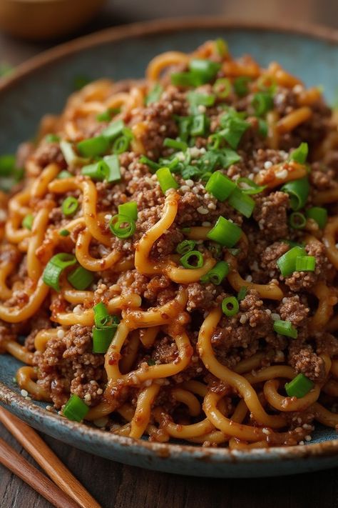 Mongolian Ground Beef Noodles Recipe

Ingredients

- 1 pound ground beef
- 8 ounces egg noodles
- 1/2 cup soy sauce
- 1 tablespoon brown sugar
- 3 green onions, chopped

Instructions

- Cook egg noodles according to package instructions; drain and set aside. 
- In a large skillet, brown the ground beef over medium heat until fully cooked; drain excess fat. 
- Full Recipe on... Egg Noodle And Beef Recipes, Ground Beef Lo Mein, Mongolian Ground Beef Noodles, Ground Beef Noodles, Mongolian Ground Beef, Soy Sauce Alternative, Beef Noodles, Budget Family Meals, Simple Green Salad