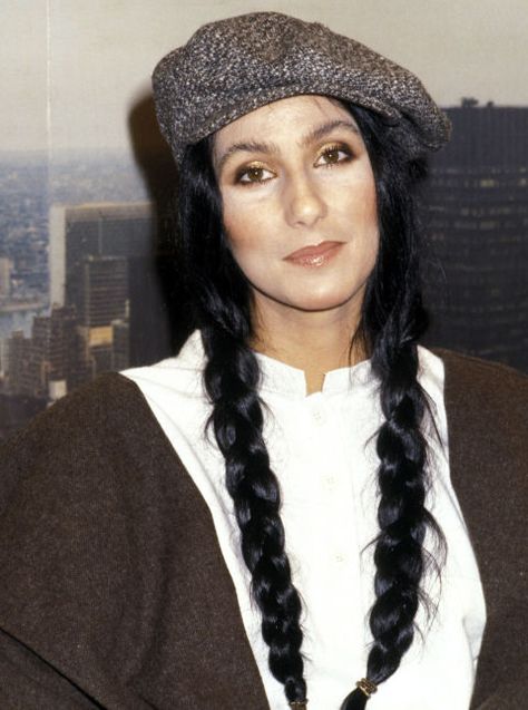 While visiting the The Stanley Siegel Show, Cher showed off her long braids under a cute newsboy cap. Super Blonde Hair, Cher Hair, Long Natural Curls, Long Layers With Bangs, Cher And Sonny, How To Look Attractive, Cher Photos, Noomi Rapace, Hair Evolution