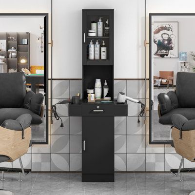 Stow all your haircut equipment with this functional barber station and say goodbye to the jumble. The black free-standing design is a great addition to any salon or room. Two upper storage cubbies with glass doors can keep the items inside orderly and clearly-seen, while the tabletop is equipped with round sleeves to hold flat irons, curling irons, hair dryer, and hair spray. The lockable drawer and bottom cabinet provide secret rooms for your big and important belongings. | Jaxpety Hair Tool H Salon Tools Hairdresser, Home Hair Salon Shampoo Station, Hair Appliance Storage With Power Outlet, Primitive Hair Salon, Hair Color Creative Storage, Hair Salon Shoe Box, Hair Salon Shelves Small Spaces, Hair Salon Space Dividers, Hair Salon Coat Rack