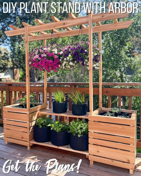 Build your own outdoor plant stand for your deck, patio or balcony! Get the woodworking plans for this gorgeous DIY plant stand with an arbor for hanging baskets or training vining plants. Use the shelves for pots of flowers or vegetables, and hang baskets of gorgeous flowers over them. Download the plans to build your own DIY outdoor plant stand with arbor at The Handyman's Daughter!