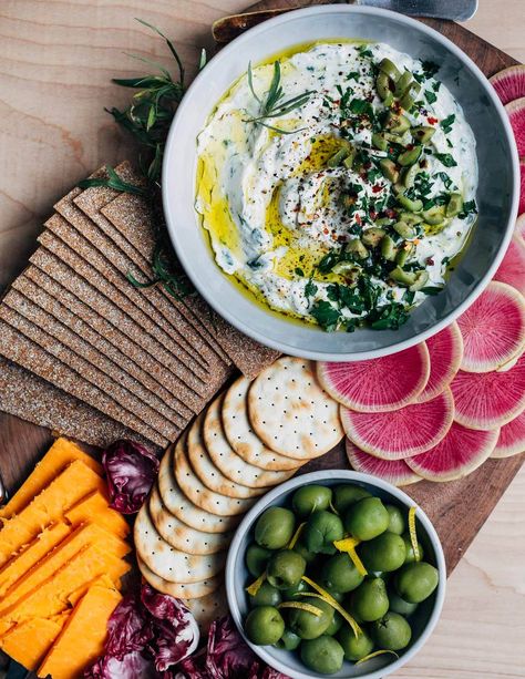 Don’t forget the appetizers! This light, tangy whipped goat cheese dip is a lovely addition to a festive holiday snack board. This delicious chèvre dip comes together in minutes and can be made up to three days ahead of time. My Thanksgiving prep is officially underway. I’ve been to the grocery store twice already and […] The post Whipped Goat Cheese Dip with Herbs and Olives appeared first on Brooklyn Supper. Whipped Goat Cheese Dip, Goat Cheese Dip, Whipped Goat Cheese, Garlic Scapes, Vegan Roast, Summer Appetizer, Cured Meats, Cheese Dip, Mint Leaves