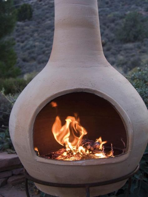 Browse options for a chiminea clay outdoor fireplace, plus browse helpful pictures from HGTV. Clay Chiminea, Outdoor Fireplace Ideas, Helpful Pictures, Clay Fire Pit, Chiminea Fire Pit, Fire Pit Decor, Fire Pots, Outdoor Fireplace Designs, Hgtv Garden