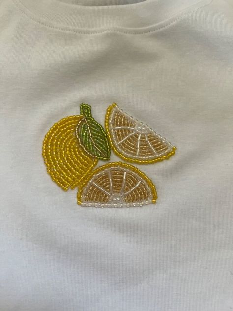 Lemon bead embroidery custom tee Lemon Bead Embroidery, Beads Clothes Diy, Embroidery Pearls Diy, Beaded Tops Diy, Bead Embroidery Shirt Ideas, Cross Stitch Clothing, Diy Beaded Embroidery, Embroidery Tee Shirts, Beaded Shirt Design