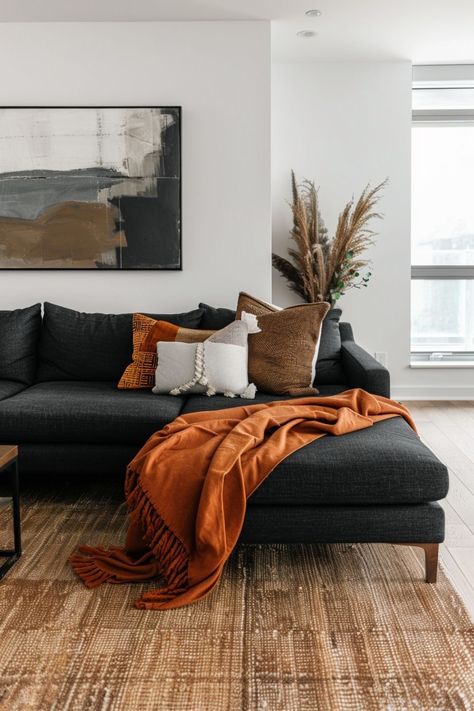 Living Room Designs Burnt Orange, Gray Burnt Orange Living Room, Industrial Mcm Living Room, Black Culture Living Room Ideas, Terracotta Grey Living Room, Rust Orange Living Room Decor, Charcoal Sofa Living Room Ideas, Black Carpet Living Room Ideas, Beige And Rust Living Room