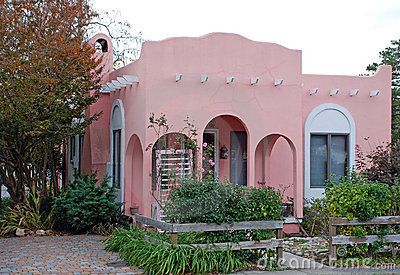 Pink Adobe House 16 by Harperdrewart, via Dreamstime Mexican House Exterior, Stucco Exterior Colors, Spanish House Exterior, Construction Fence, Small House Exterior, Mission Style Homes, Spanish Bungalow, Stucco Homes, Adobe House