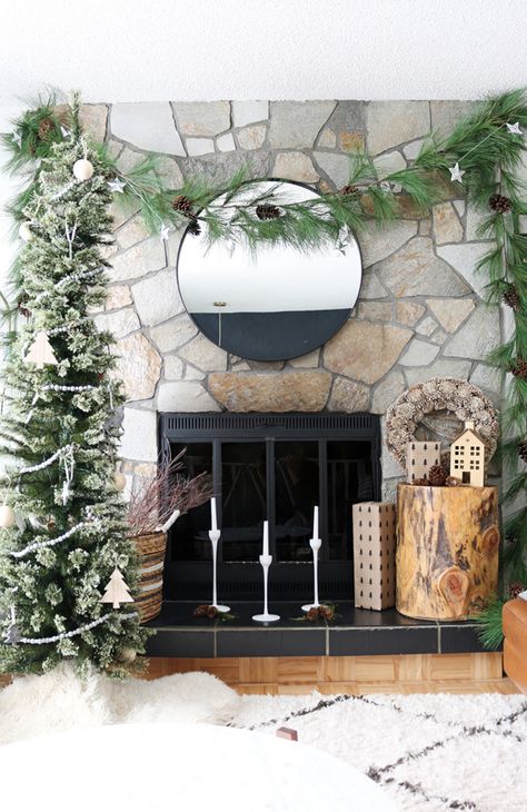 No mantle? No worries! You can still cozy up next to your fresh and inviting fireplace this holiday season with these simple steps. #["Christmas", "How-To", "holiday decor", "scandinavian", "rustic", "decorating", "living room", "accessories", "decor", "featured", "Holiday", "fireplace", "mantle", "inexpensive"] Christmas Decor Without A Mantle, Fireplace With No Mantle Decor, Christmas Decor Fireplace No Mantel, Christmas Fireplace With No Mantle, Fireplace No Mantle Decor, Christmas Fireplace Without Mantle, Decorating Fireplace Without Mantel, No Mantle Fireplace Decor, Fireplace Without Mantle Christmas