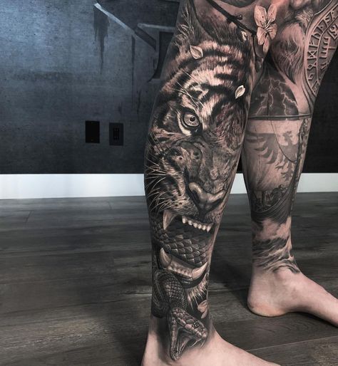 Final pass on this leg the other day . Smaller cover up under tiger face . Done with #worldfamousink #bishoprotary #mithramfg . Thank you | Instagram Tiger Leg Sleeve Tattoo, Tiger Tattoo Leg, Animal Tattoo Designs, Aztec Tattoos Sleeve, Chest Tattoo Drawings, Jungle Tattoo, Best Leg Tattoos, Animal Sleeve Tattoo, African Tattoo