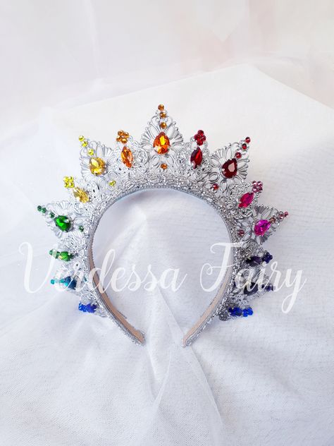 This silver tiara crown halo has metal lace filigree mounted to a headband with sparkly bright rainbow  colour glass and Swarovski rhinestones. An elegant and beautiful piece that is excellent for so many occasions from Mardi Gras, dance costumes to dressing up as a queen, photo shoots and special occasions. This beautiful crown is elegant and fun. A halo of silver coloured filigree to adorn the top of the head with bright rainbow Swarovskis and glass rhinestones for extra colour and sparkle.  M Fantasy Crown Headpieces For Festival, Whimsical Adjustable Crown For Festivals, Mardi Gras Dance, Whimsical Carnival Crown Headpiece, Queen Headpiece, Mardi Gras Crown, Whimsical Crown-shaped Festival Headband, Rainbow Crown, Viridescent Crown