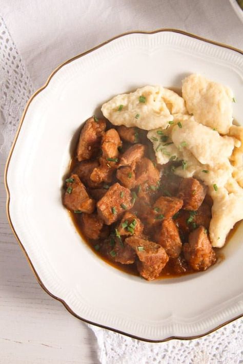 Hungarian pörkölt recipe, pork pieces in an aromatic onion and sweet paprika sauce, served with flour dumplings – nokedli. Porkolt Recipe, Pork Stew Meat Recipes, Pork Pieces, Pork Stew Meat, Baked Bbq Ribs, Stew And Dumplings, Hungarian Paprika, Eastern European Recipes, Hungarian Cuisine