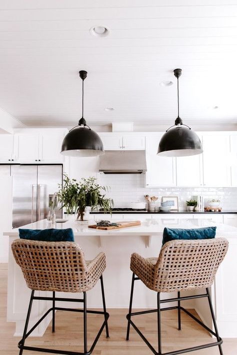 Modern Farmhouse White Kitchen with Black Pendant Lights and Black and Wicker Bar Stools White Kitchen With Table, Wicker Bar Stools Kitchen, Kitchen With Table, Bar Stools Kitchen, Wicker Bar Stools, Stools Kitchen, Kabinet Dapur, Cottage Kitchens, Scandinavian Kitchen