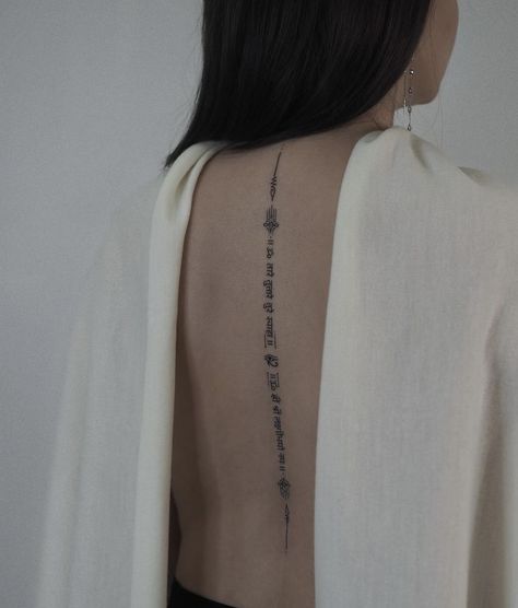 Buddhist Spine Tattoo, Mantra Tattoo Design For Women, Hindi Tattoos Women, Bhuddist Tattoos, Hindi Tattoo, Back Tattoo Women Spine, Mantra Tattoo, Buddhist Tattoo, Hidden Tattoos