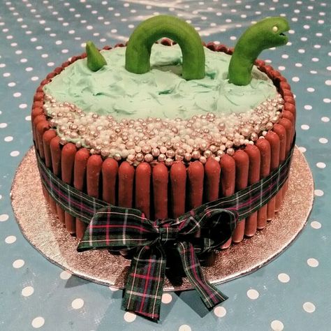 Loch Ness monster scottish cake. For my youngest boys 3rd birthday. Just back from a holiday to loch ness :-) Scottish Cakes Ideas, Scottish Cake Decoration, Scottish Birthday Party, Leaving Cake, Baby Birthday Idea, Scottish Party, European Day Of Languages, Festival Of Tables, Edinburgh Christmas