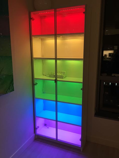 Billy bookcase with cheap IKEA Dioder lights. Dioder changes to any color with ease. Have fun or be serious as you choose. Cool Display Ideas, Rainbow Gaming Room, Gaming Bookshelf, Cheap Ikea Hacks, Rainbow Bookcase, Bookcase Ikea, Diy Shelf Decor, Ikea Lighting, Rainbow Room Decor