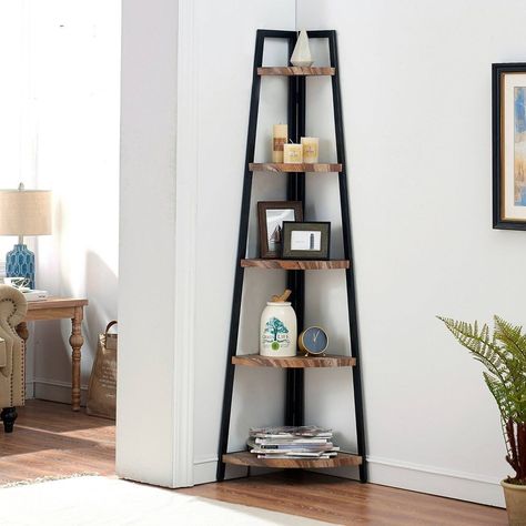 A corner ladder display shelving unit so it can finally fill that — you guessed it — corner space you don't know what to do with. Use it as a resting place for all of your art pieces, decor items, and even fun trinkets. The industrial metal frame gives off a nice edgy vibe if your style is more punk rock and less chill farmhouse. Diy Shelves Design, Corner Shelf Ideas, Diy Pipe Shelves, Wood Corner Shelves, Ladder Shelves, Corner Bookshelves, Salon Suites, Bookshelves Diy, Corner Shelf