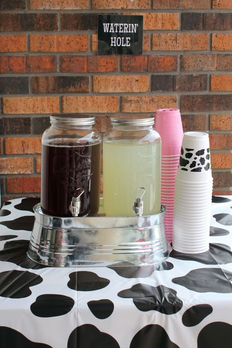 Iced tea and lemonade waterin hole...refreshing drink station! Note: On the bottom of the pink cups, I used a black sharpie to make a pig snout. Cow Themed Food For Party, Pink Farm Birthday Party Food, Cow Girl Birthday Party Theme Teen, Holy Cow I’m One Party Foods, Cowgirl Birthday Party Food Ideas, My First Rodeo Birthday Girl Food, Cow Party Food Ideas, Cow Birthday Party Food, Cow Themed Birthday Party Food