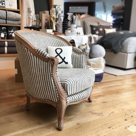 Sit in style in the perfect chair with classic ticking and washed wood. Created exclusively for Pottery Barn with renowned stylists and fashion designers Emily Current and Meritt Elliott, this collection offers both style and whimsy. #potterybarnstanford #potterybarn #mypotterybarn ##homefurnishings #homedecor #emilyandmeritt #blackandwhite Ticking Stripe Chair, Bedroom Extension, Stripe Chair, Deconstructed Chair, Beach Glam, Black Dining Room Chairs, Striped Chair, Striped Room, Upholstered Armchair