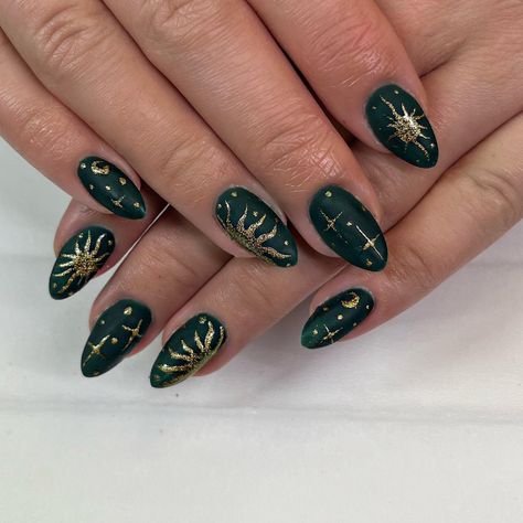 Dark Green Nails with Sun, Moon, and Stars Nail Inspo Celestial, Sun Moon And Stars Nail Art, Gold And Forest Green Nails, Dark Green Celestial Nails, Nail Ideas Dark Green And Gold, Dark Moon Nails, Sun On Nails Art Designs, Dark Green Nails Gold Accent, Blue Gold And Black Nails