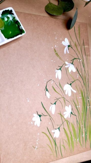 Sandhya on Instagram: "More Snowdrops 🤍 Warmup on kraft sturdy mailer before painting on watercolor paper. Makes the perfect packaging for sending off the painting to it’s forever home. #gouachepainting #gouacheflowers #gouacheflorals #mailart #gouacheonkraft #snowdropspainting #januarybirthflower #paintingpractice #paintingprocess #paintwithme #sandysartsystudio" Snow Drop Flower Painting, Snowdrop Painting Acrylic, Snow Drop Painting, Snowdrop Flower Painting, Snowdrops Painting, Snowdrop Painting, How To Draw Snow, Snow Drops Flowers, Gouache Flowers