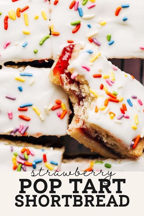 The BEST buttery shortbread baked with a layer of sweet and tart strawberry jam in the center and topped with vanilla icing. Strawberry Shortbread Recipe, Butternut Bakery, Strawberry Pop, Strawberry Pop Tart, Buttery Shortbread, Shortbread Bars, Strawberry Dessert Recipes, Pop Tart, Shortbread Recipes