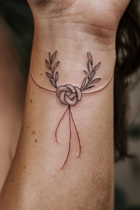 Intricate knot tattoo with leaf accents on a forearm. Knots Tattoo, Infinity Knot Tattoo, Knot Tattoos, Tattoo Ideas For Females, Rope Tattoo, Bowline Knot, Powerful Symbols, Loop Knot, Knot Tattoo