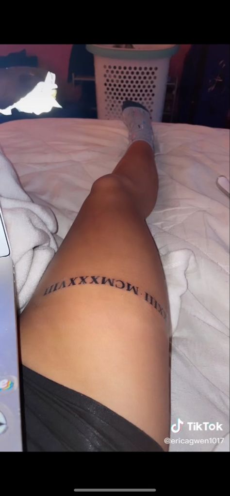 Leg Tattoos Roman Numerals, Roman Numerals Leg Tattoo, Thigh Roman Numeral Tattoo, Roman Numeral Tattoo On Thigh, Thigh Ring Tattoos Women, Roman Numeral Tattoo On Leg, Roman Numeral Tattoo Above Knee, Roman Numeral Leg Tattoo, Thigh Ring Tattoo