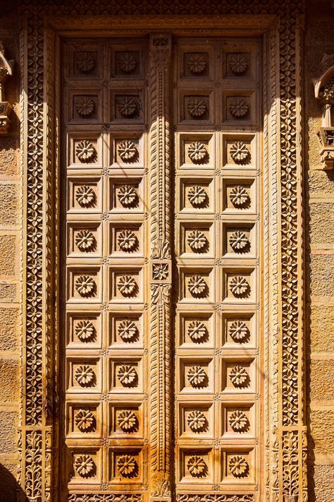 A large wooden door with intricate carvings on it photo – Free India Image on Unsplash Large Wooden Door, Temple Doors, Temple Door, Wallpaper Door, Hd Design, Jain Temple, Map Marker, India Images, Windows Wallpaper